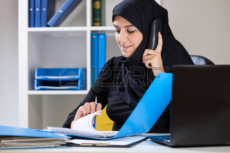 religious clothing: View of female muslim in the office Stock Photo
